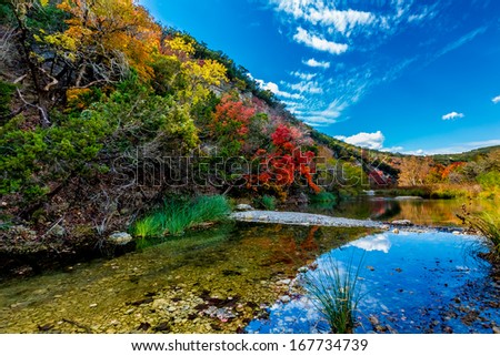  - stock-photo-beautiful-fall-foliage-surrounding-the-crystal-clear-sabinal-river-at-lost-maples-state-park-texas-167734739