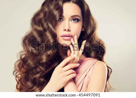 http://thumb7.shutterstock.com/display_pic_with_logo/1054231/454497091/stock-photo-brunette-girl-with-long-shiny-wavy-hair-beautiful-model-with-curly-hairstyle-woman-with-454497091.jpg