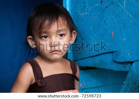 http://thumb7.shutterstock.com/display_pic_with_logo/10642/10642,1299454786,1/stock-photo-young-asian-girl-from-poverty-stricken-area-in-manila-philippines-72598723.jpg