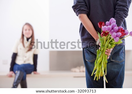 http://thumb7.shutterstock.com/display_pic_with_logo/1294/1294,1245095472,1/stock-photo-romantic-man-giving-flowers-to-his-girlfriend-32093713.jpg