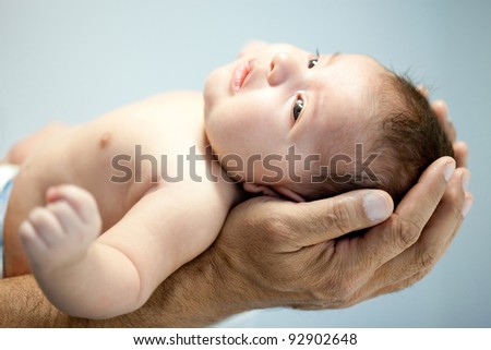 Download this Man Holding Baby Stock... picture