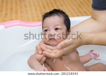 http://thumb7.shutterstock.com/display_pic_with_logo/1562231/281218541/stock-photo-newborn-baby-taking-a-bath-by-mother-at-home-asian-child-281218541.jpg