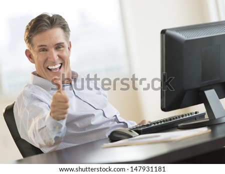 stock-photo-excited-mature-businessman-g