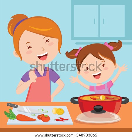 Mother and daughter cooking food together Mother and daughter cooking food together