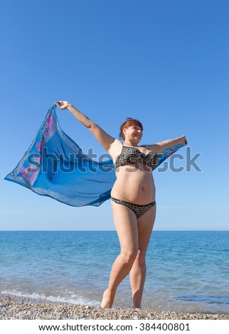 Middle Aged Woman On The Rocky Beach Stock Photo - Image 
