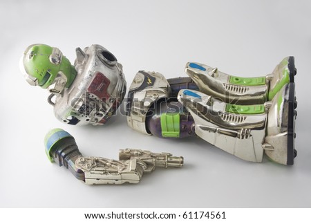 stock-photo-old-robot-toy-broken-and-dam