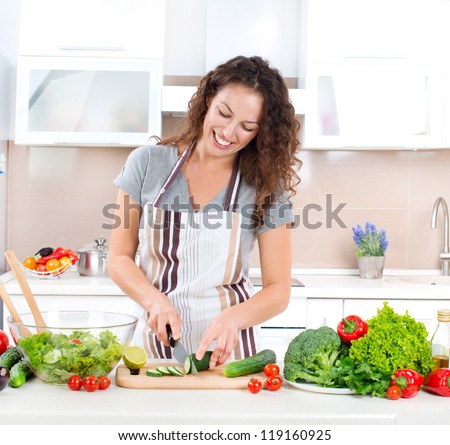 http://thumb7.shutterstock.com/display_pic_with_logo/195826/119160925/stock-photo-young-woman-cooking-healthy-food-vegetable-salad-diet-dieting-concept-healthy-lifestyle-119160925.jpg
