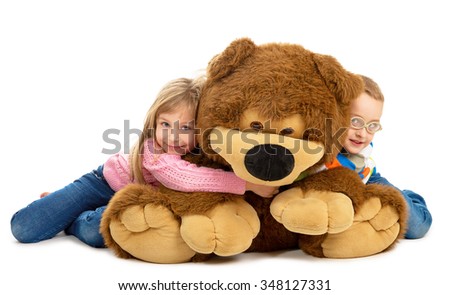 hugging big teddy bear