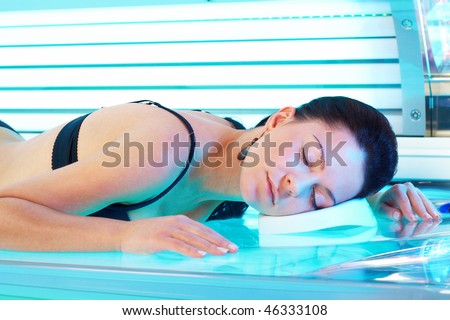 Young Woman In Bikini Sunbathing Lying On The Beach Stock 