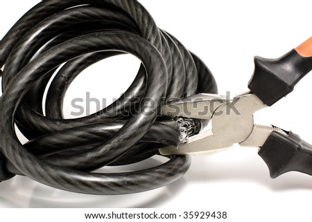 Cut opening a bike lock - stock photo