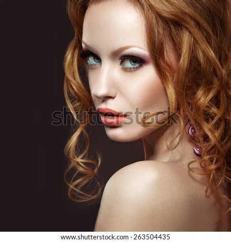 http://thumb7.shutterstock.com/display_pic_with_logo/2256221/263504435/stock-photo-beautiful-red-haired-girl-with-bright-makeup-and-curls-picture-taken-in-the-studio-on-a-black-263504435.jpg