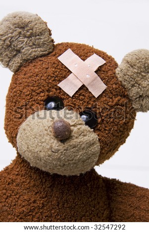 teddy bear with bandage on head