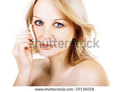 A gorgeous middle aged woman removing her make up with a <b>cotton wool</b> pad on <b>...</b> - stock-photo-a-gorgeous-middle-aged-woman-removing-her-make-up-with-a-cotton-wool-pad-on-a-white-background-59136058