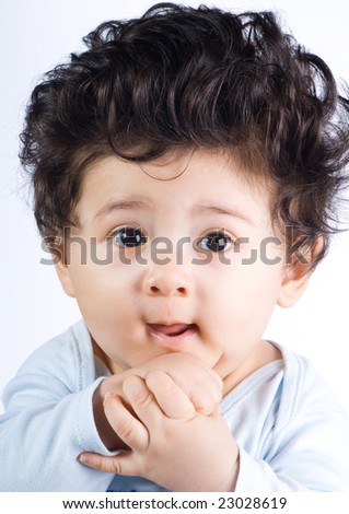 stock-photo-cute-baby-boy-with-long-hair-23028619.jpg