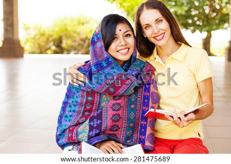 http://thumb7.shutterstock.com/display_pic_with_logo/273727/281475689/stock-photo-european-woman-volunteering-in-nepal-teaching-a-poor-asian-woman-to-speak-english-language-281475689.jpg