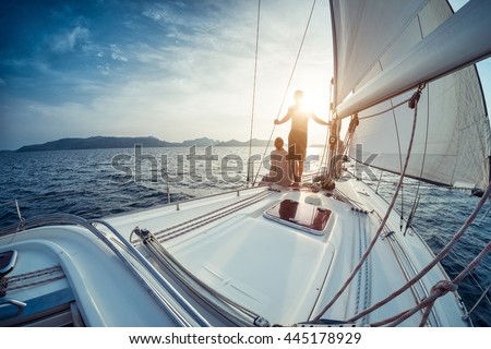 http://thumb7.shutterstock.com/display_pic_with_logo/295900/445178929/stock-photo-young-couple-looking-to-the-sunset-on-the-yacht-in-andaman-sea-445178929.jpg