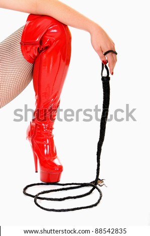 stock-photo-woman-in-high-red-shiny-leather-boots-holding-bull-whip-88542835.jpg