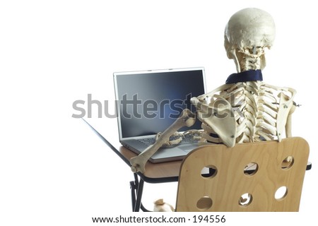 stock-photo-a-skeleton-sits-at-a-desk-typing-on-a-laptop-computer-194556.jpg