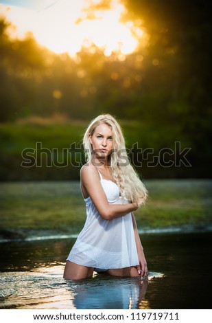 http://thumb7.shutterstock.com/display_pic_with_logo/315760/119719711/stock-photo-sexy-blonde-woman-in-lingerie-in-a-river-water-sexy-young-woman-relaxing-on-the-beach-young-119719711.jpg