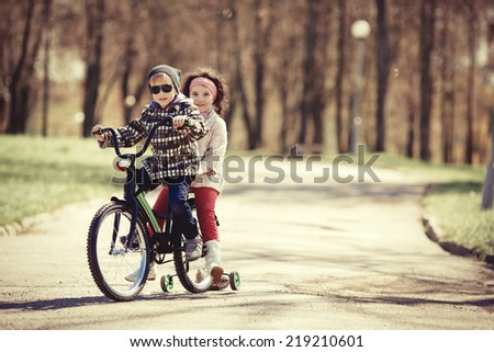 boy and girl riding bicycle