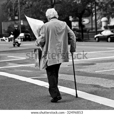 Old Man Crossing Street Stock Photos, Images, & Pictures 