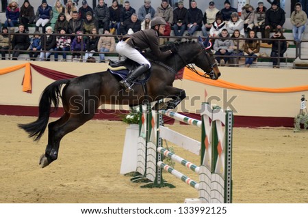  - stock-photo-kaposvar-hungary-march-andras-zajzon-jumps-with-his-horse-conrad-on-the-masters-tournament-133992125