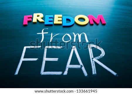 Freedom from fear, colorful conceptual words on blackboard. - stock photo