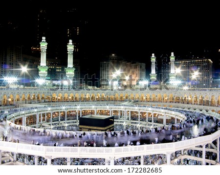 Kaaba the Holy mosque in Mecca with Muslim people pilgrims of Hajj praying in crowd (newest and very rare images of Holiest mosque after latest widening 2013-3014) - stock photo