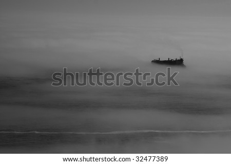 stock-photo-container-ship-in-fog-32477389.jpg