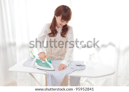 Asian Woman Folding Shirt 76