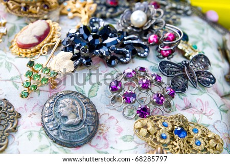 Vintage jewelry at the flea market (focus is on purple one, shallow ... Vintage jewelry at the flea market (focus is on purple one, shallow ...