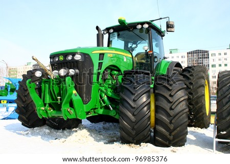 UFA, RUSSIA - MARCH 14: Large modern John Deere 8430 four wheel drive tractor