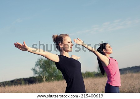 photo outdoors women shows instructor poses outdoors.  yoga   yoga stock doing yoga poses