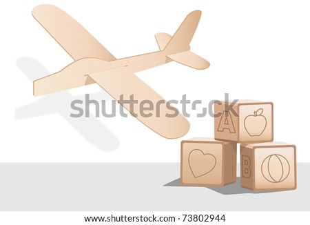 Balsa wood toy airplane and wooden baby building blocks. - stock 