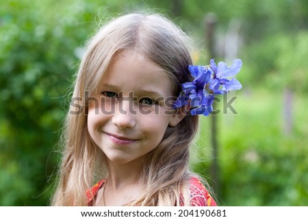 portrait of small caucasian girl with <b>blue iris</b> flower in her hair - stock <b>...</b> - stock-photo-portrait-of-small-caucasian-girl-with-blue-iris-flower-in-her-hair-204190681