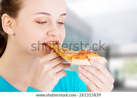 http://thumb7.shutterstock.com/display_pic_with_logo/52959/261315839/stock-photo-young-beautiful-woman-eating-pizza-261315839.jpg