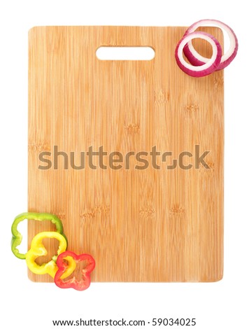  , Design element of a clean, new cutting board and vegetable slices