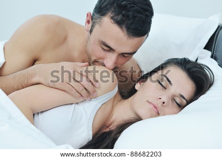 man and woman making love in bed man and woman making love in bed