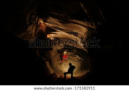  - stock-photo-spelunkers-exploring-an-underground-cave-hall-171582911