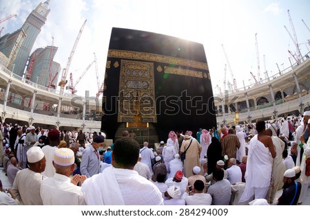 MECCA, SAUDI ARABIA-CIRCA MAY 2015: Fisheye view of Muslims gettiing ready to pray around the Kaaba in Masjidil Haram in Makkah, Saudi Arabia. The mosque is under construction to expand space for hajj - stock photo