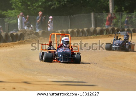 Karts Racing On Dirt Track Stock Photo 13312633 - Shutterstock