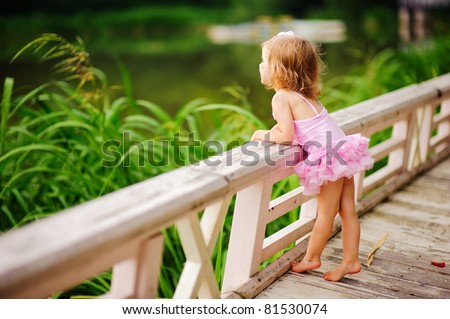 stock-photo-fashion-little-girl-in-tutu-swimsuit-have-a-fun-outdoor-81530074.jpg