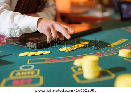 stock-photo-casino-table-with-yellow-chips-166522085.jpg