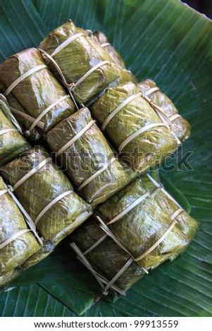  - stock-photo-thai-dessert-called-kao-tom-mud-wrapped-with-banana-leaf-99913559