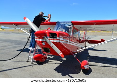  - stock-photo-shafter-ca-may-retired-oil-company-pilot-jerry-sears-fuels-his-beautiful-citabria-190713605