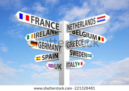 Europe destinations and flags signpost against blue sky  stock photo