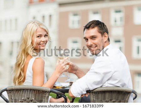 http://thumb7.shutterstock.com/display_pic_with_logo/64260/167183399/stock-photo-summer-holidays-and-dating-concept-smiling-couple-drinking-wine-in-cafe-in-the-city-167183399.jpg
