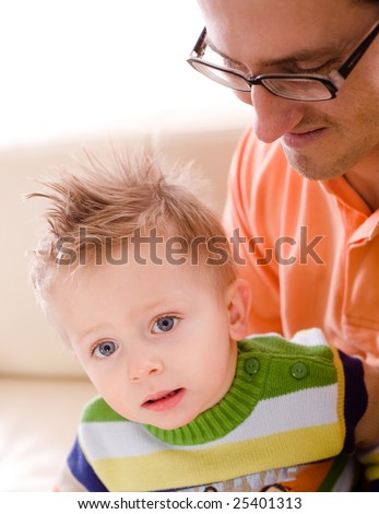 Father and baby boy enjoy time together at home. - stock photo - stock-photo-father-and-baby-boy-enjoy-time-together-at-home-25401313