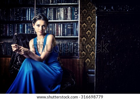 http://thumb7.shutterstock.com/display_pic_with_logo/67164/316698779/stock-photo-elegant-lady-wearing-evening-dress-sitting-in-the-chair-in-the-old-vintage-library-beauty-fashion-316698779.jpg