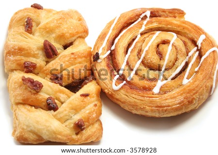 cinnamon swirl and a maple/pecan danish pastry close up - stock photo